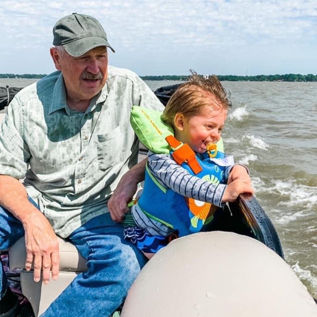 a man and a child on a boat a man and a child on a boat
